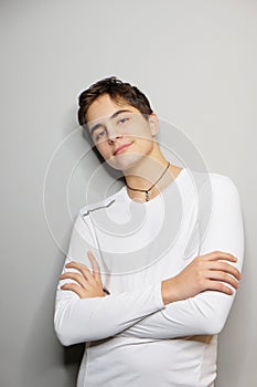 Handsome young guy, studio shot isolated on grey background