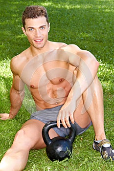 Handsome Young Hunk Sitting on Grasses