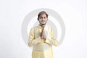 Handsome Young Indian Man Showing Namaste or welcome gesture, Isolated on White Background