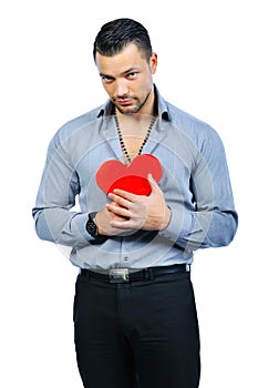 Handsome macho man holding love heart portrait - isolated