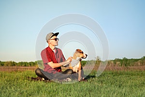 Handsome young male dog owner and staffordshire terrier dpg photo