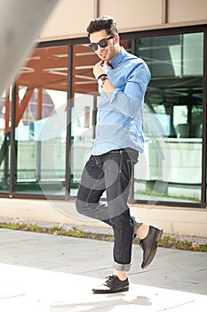 Handsome young male model posing outdoors