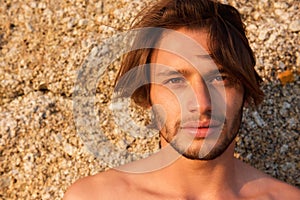 Handsome young man with beard shirtless