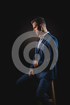 Handsome young man in a beautiful blue suit