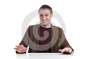 Handsome young man behind desk