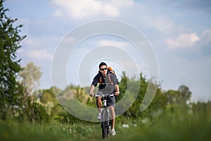 Handsome young man biking