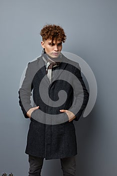 handsome young man Black coat posing fashion isolated background