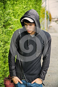 Handsome young man in black hoodie sweater