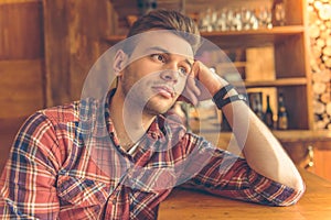 Handsome young man at cafe