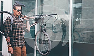 Handsome Young Man Ciyclist With Glasses Carries Bicycle On His Shoulder Street Daily Routine Lifestyle