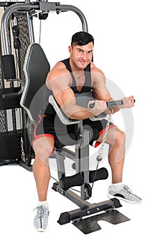 Handsome young man doing lateral pull-down workout isolated on white