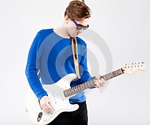 Handsome young man with electric guitar