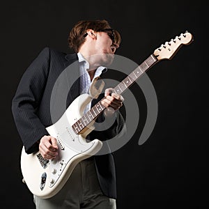 Handsome young man with electric guitar
