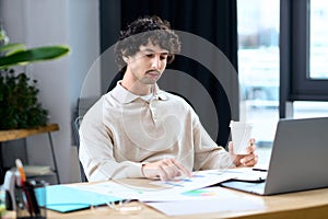 Handsome young man focused on work