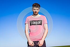 Handsome young man on green filed