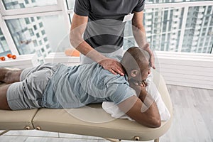 Handsome young man having a massage therapy