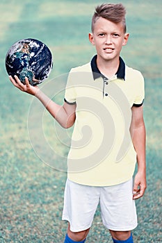 Handsome young man holding planet earth in his hands. Elements of this image furnished by NASA