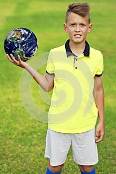 Handsome young man holding planet earth in his hands. Elements of this image furnished by NASA