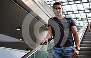 Handsome young man inside a train station