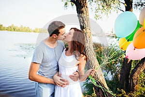 Handsome young man kissing his girlfriend