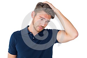 Handsome young man looking confused