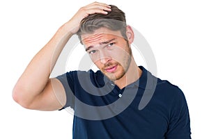 Handsome young man looking confused