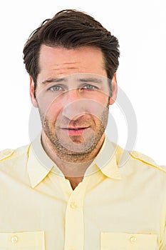 Handsome young man looking confused