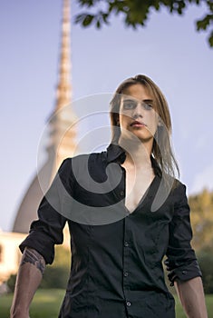 Handsome young man next to Mole Antonelliana in Turin, Italy photo