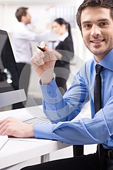 Handsome young man participating at training course.