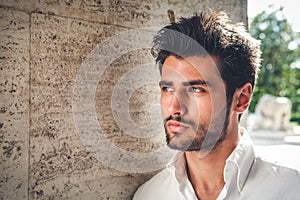 Handsome young man portrait. Intense look and eye-catching beauty