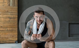 Handsome young man relax at gym after training