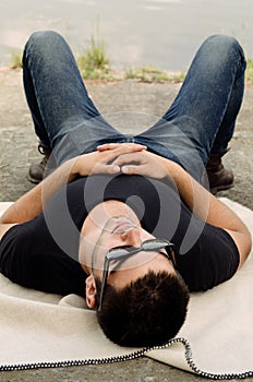 Handsome young man relaxing in the sun