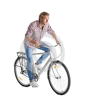 Handsome young man riding bicycle