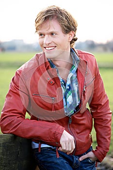 Handsome Young Man Smiling and Looking Away