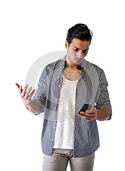 Handsome young man typing on cell phone, worried