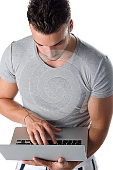 Handsome young man using laptop computer