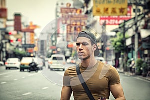 Handsome young man walking in Bangkok, Thailand