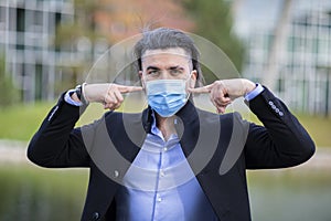 Handsome young man wearing corona mask