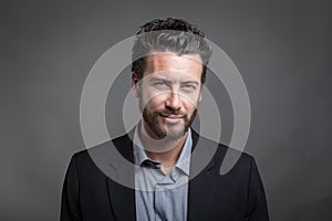 Handsome young man wearing grey suit