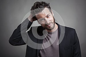 Handsome young man wearing grey suit