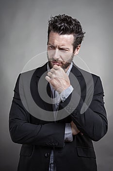 Handsome young man wearing grey suit