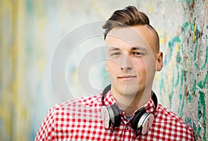 Handsome young man wearing headphones