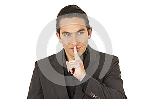 Handsome young man wearing a suit posing gesturing