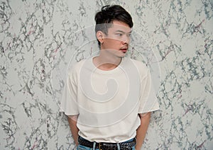 Handsome young man on white background looking at camera , portrait studio . Asia