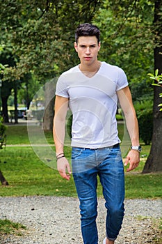 Handsome young man in white t-shirt outdoor in