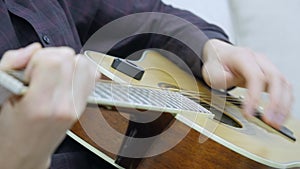 Handsome young men playing guitar