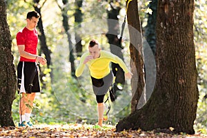 Handsome young men wearing sportswear and exercising in forest a