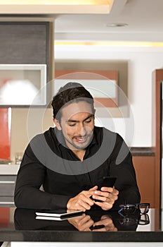 Handsome young modern man using cell phone