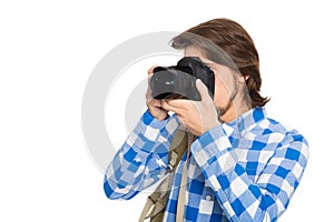 Handsome young photographer with camera in summer suit
