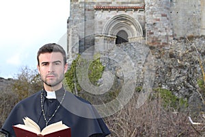 Handsome young priest close up with copy space